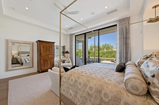 a view of a patio with table and chairs and potted plants