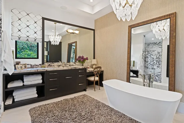 a view of a house with swimming pool and a chairs