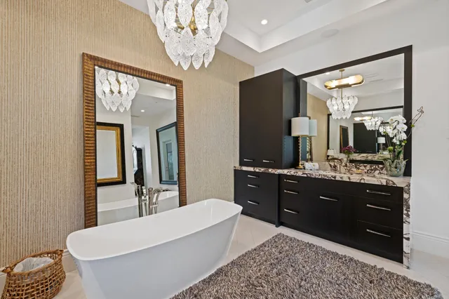 a view of a swimming pool with a yard and a fountain