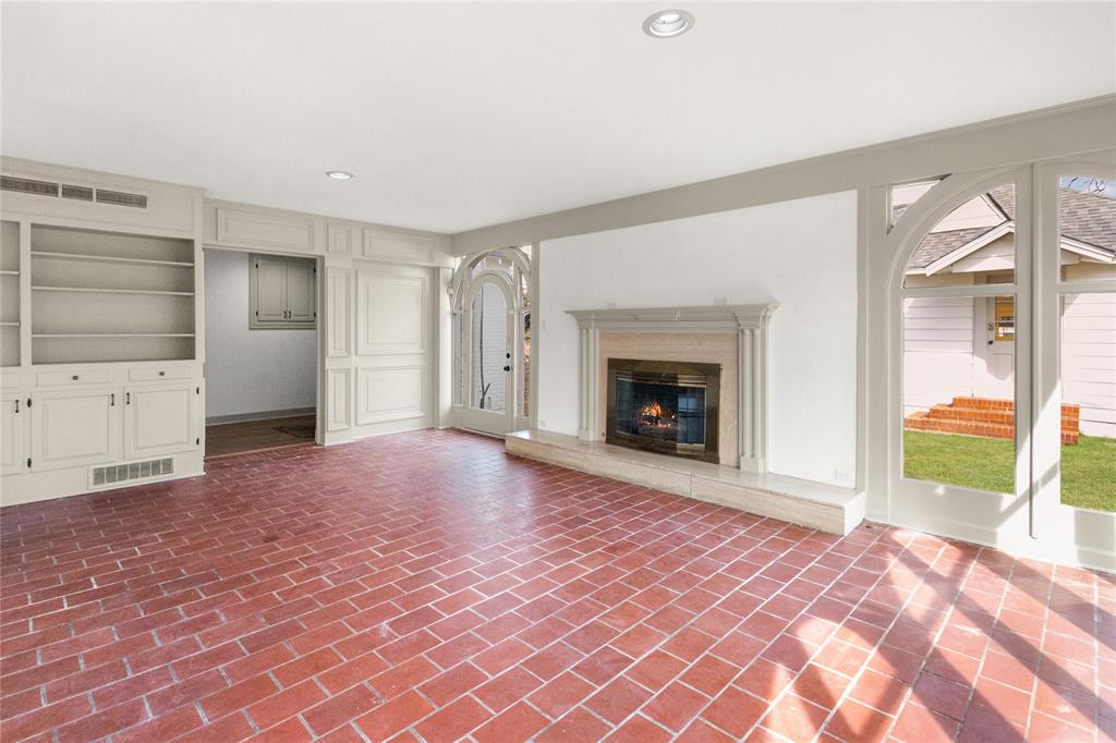 401 West 4th Street Tyler, TX 75701 - Photo 17 of 34 a view of empty room with a fireplace and wooden floor