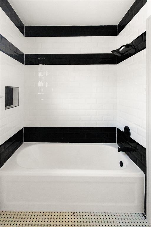 401 West 4th Street Tyler, TX 75701 - Photo 19 of 34 a bathroom with a bathtub and a shower