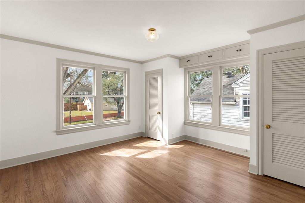 401 West 4th Street Tyler, TX 75701 - Photo 20 of 34 a view of an empty room with wooden floor and a window