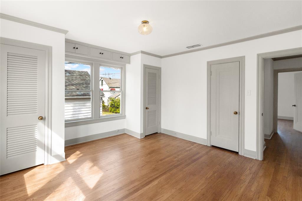 401 West 4th Street Tyler, TX 75701 - Photo 21 of 34 a view of an empty room with wooden floor and a window