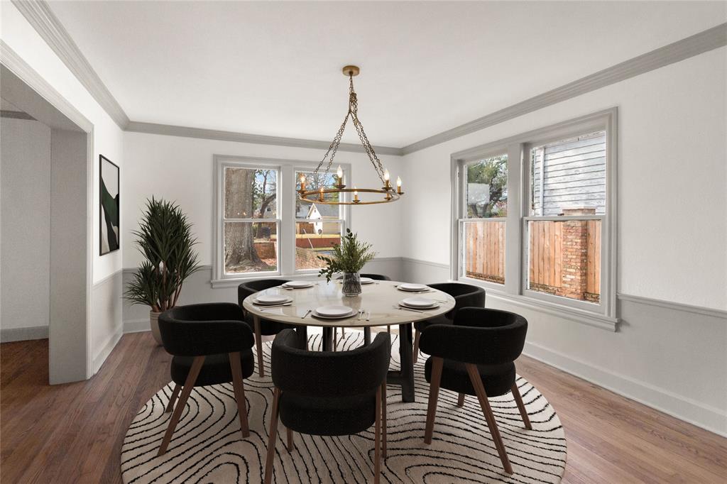 401 West 4th Street Tyler, TX 75701 - Photo 3 of 34 a dining room with furniture a chandelier and wooden floor
