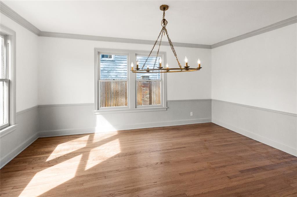 401 West 4th Street Tyler, TX 75701 - Photo 4 of 34 a view of a room with wooden floor chandelier and windows