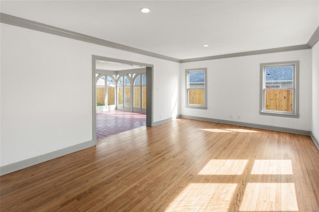 401 West 4th Street Tyler, TX 75701 - Photo 8 of 34 a view of an empty room with wooden floor and a window