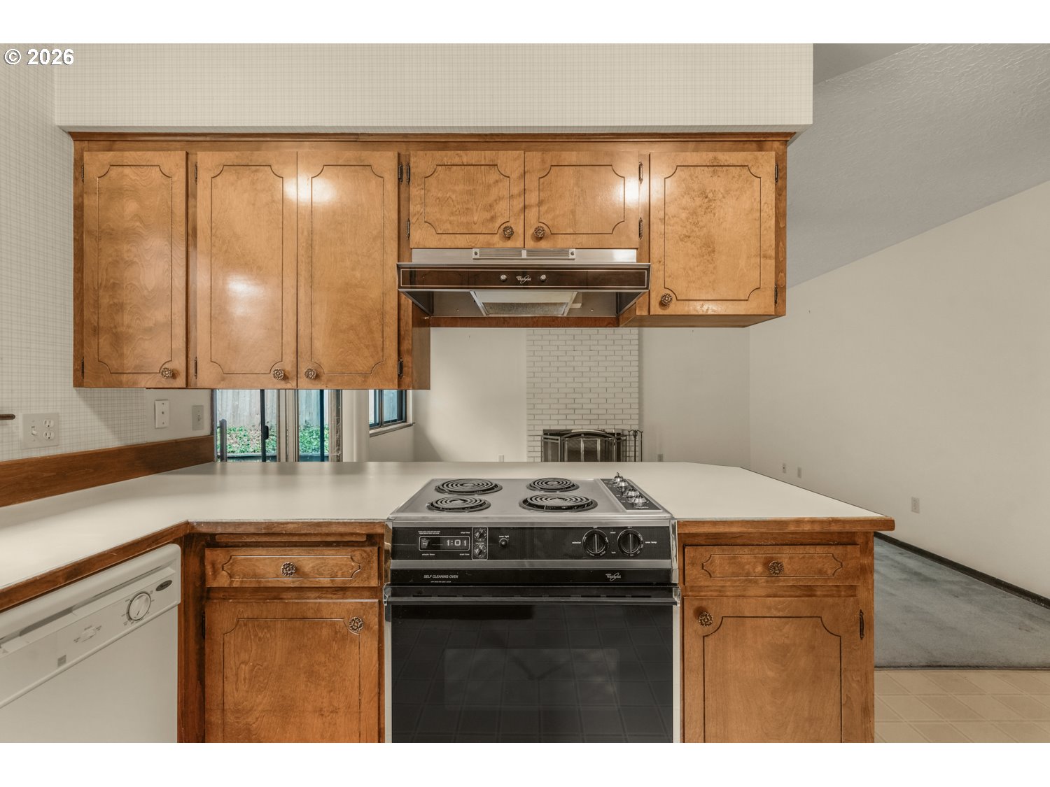 14155 Southwest 27th Street Beaverton, OR 97008 - Photo 12 of 27 a kitchen with a stove and a sink