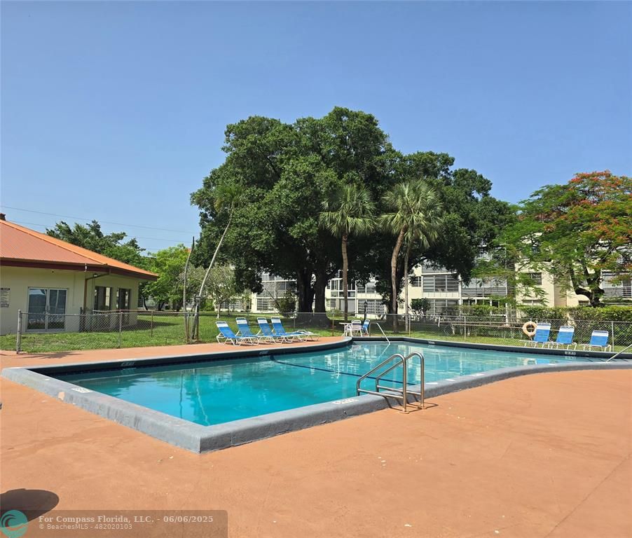 3000 Northwest 48th Terrace, Unit 430 Lauderdale Lakes, FL 33313 - Photo 14 of 15 a view of outdoor space with swimming pool and patio