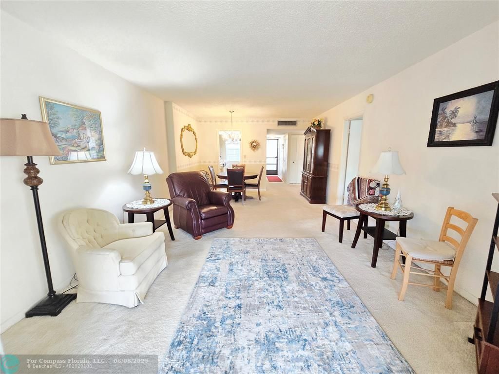 3000 Northwest 48th Terrace, Unit 430 Lauderdale Lakes, FL 33313 - Photo 2 of 15 a living room with furniture and a rug