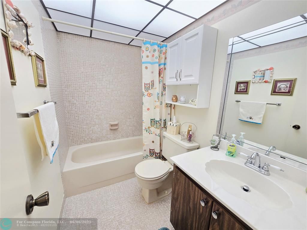 3000 Northwest 48th Terrace, Unit 430 Lauderdale Lakes, FL 33313 - Photo 10 of 15 a bathroom with a sink a toilet and a bathtub