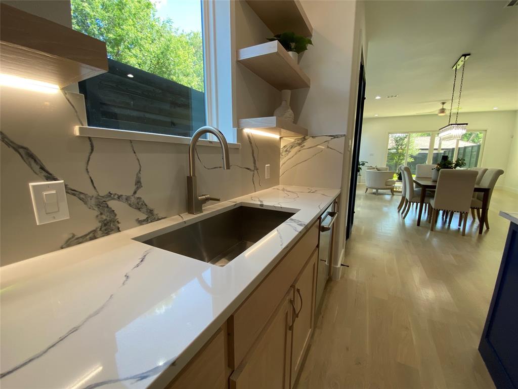 807 South Glasgow Drive Dallas, TX 75223 - Photo 6 of 25 a kitchen with a sink a counter top space and appliances