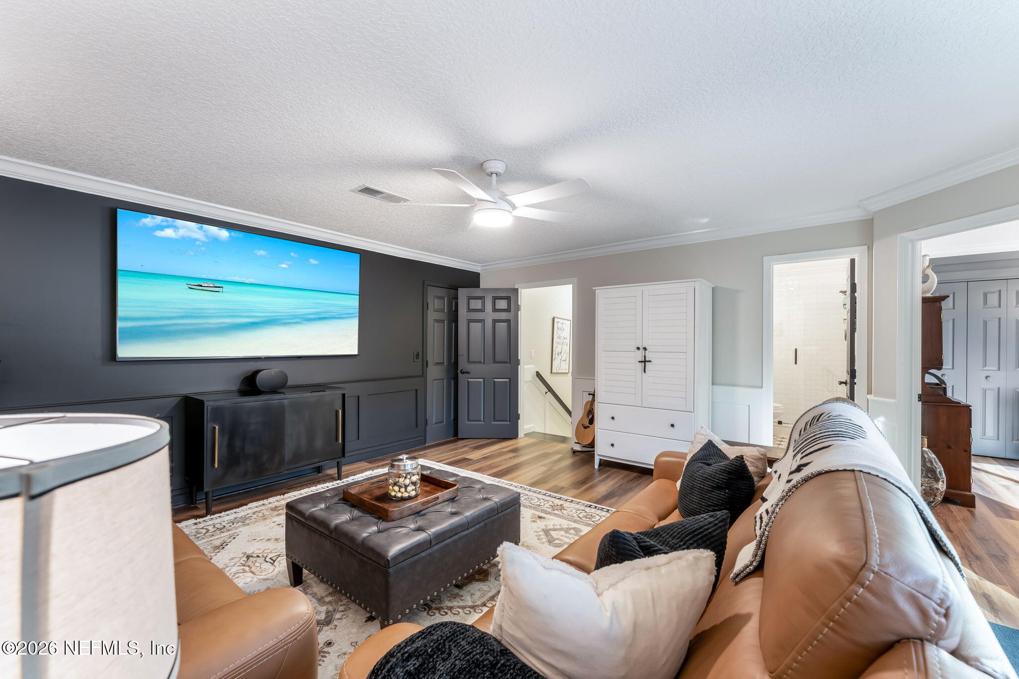 1204 Creek Bend Road St. Johns, FL 32259 - Photo 63 of 107 a living room with furniture and a flat screen tv