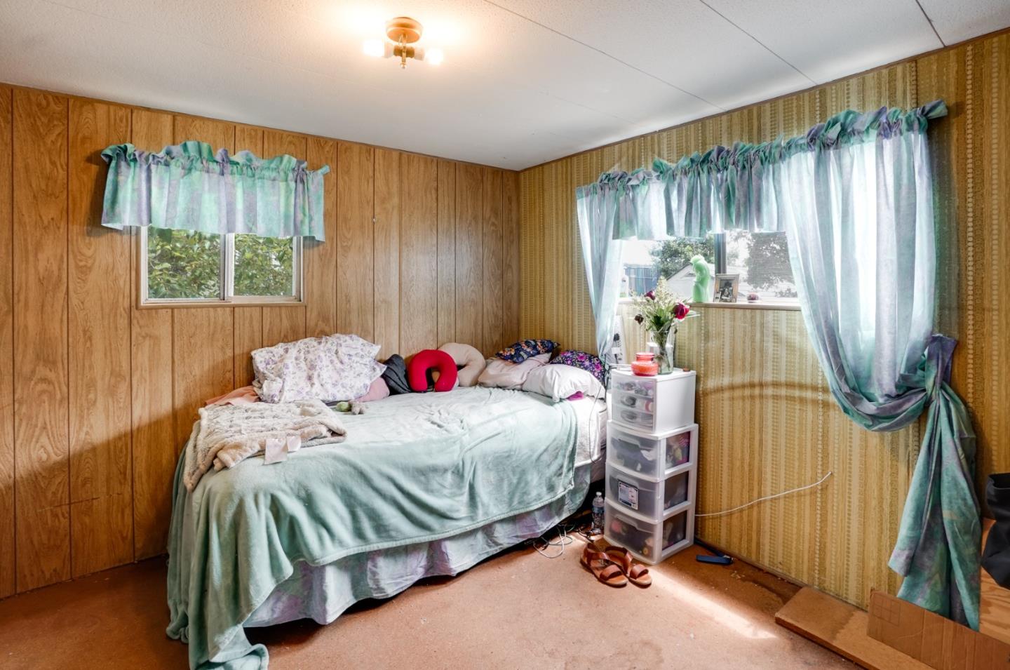 2 Sea Shell Circle, Unit 2 Half Moon Bay, CA 94019 - Photo 14 of 28 a bedroom with a bed and a window