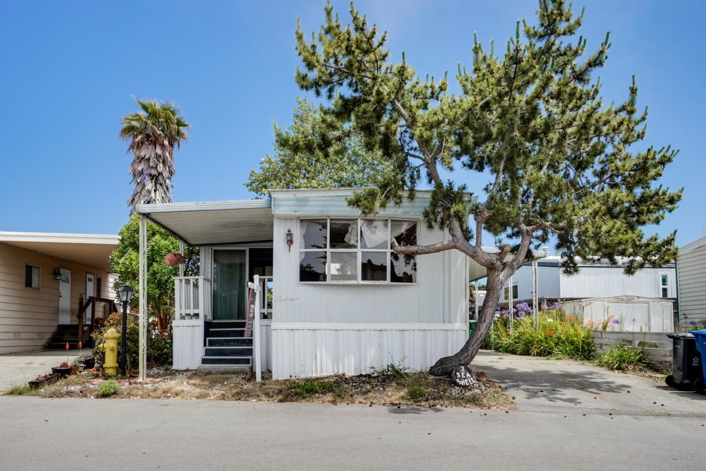 2 Sea Shell Circle, Unit 2 Half Moon Bay, CA 94019 - Photo 2 of 28 a view of a house with a tree