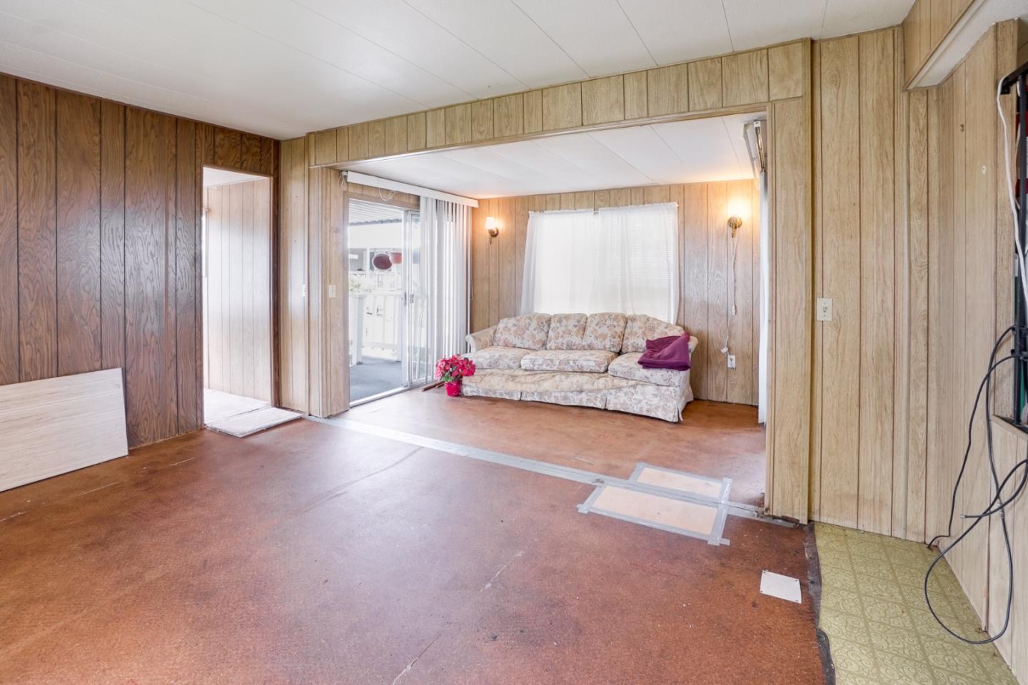 2 Sea Shell Circle, Unit 2 Half Moon Bay, CA 94019 - Photo 8 of 28 a living room with furniture and a flat screen tv