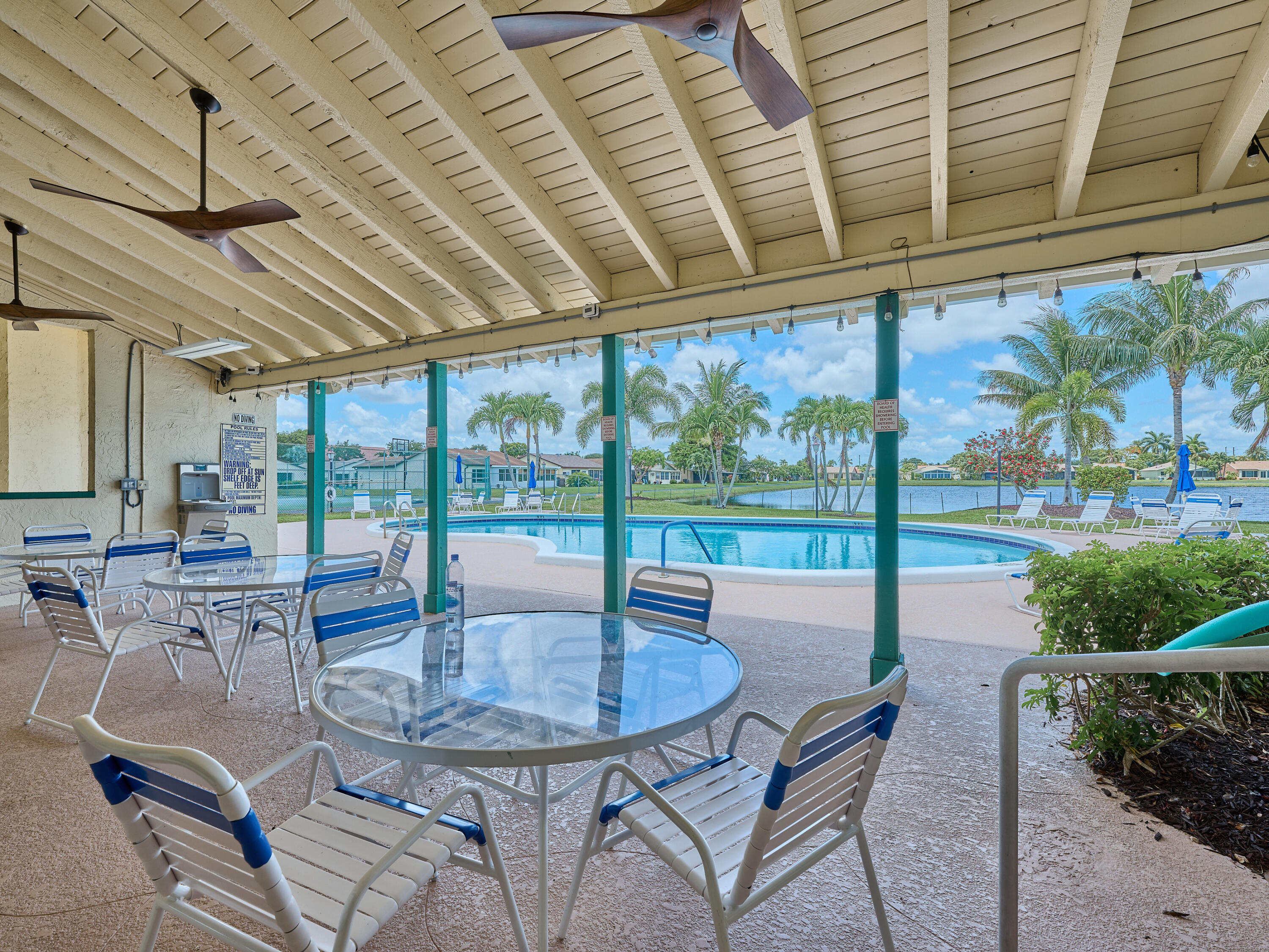 5197 Minto Road Boynton Beach, FL 33472 - Photo 30 of 32 a view of a patio with a table and chairs