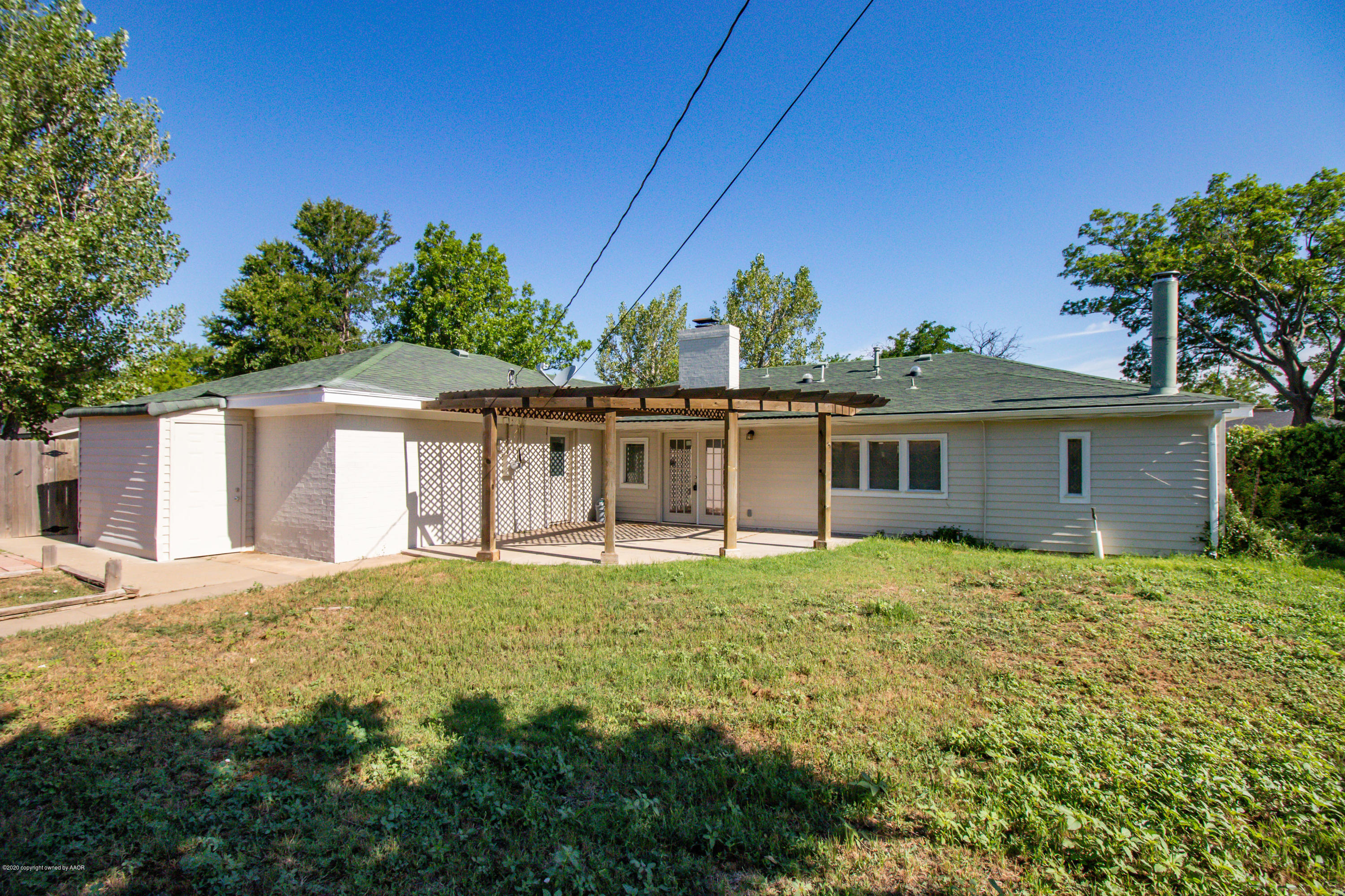 6605 Dreyfuss Road Amarillo, TX 79106 - Photo 32 of 39 a big white house with a big yard and large trees