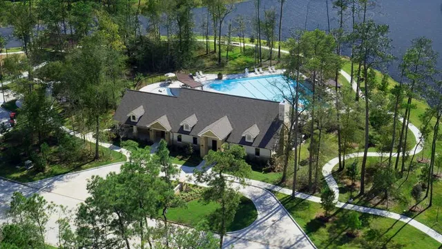 a view of a swimming pool with a lounge chairs