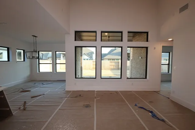 a view of an empty room with a fireplace