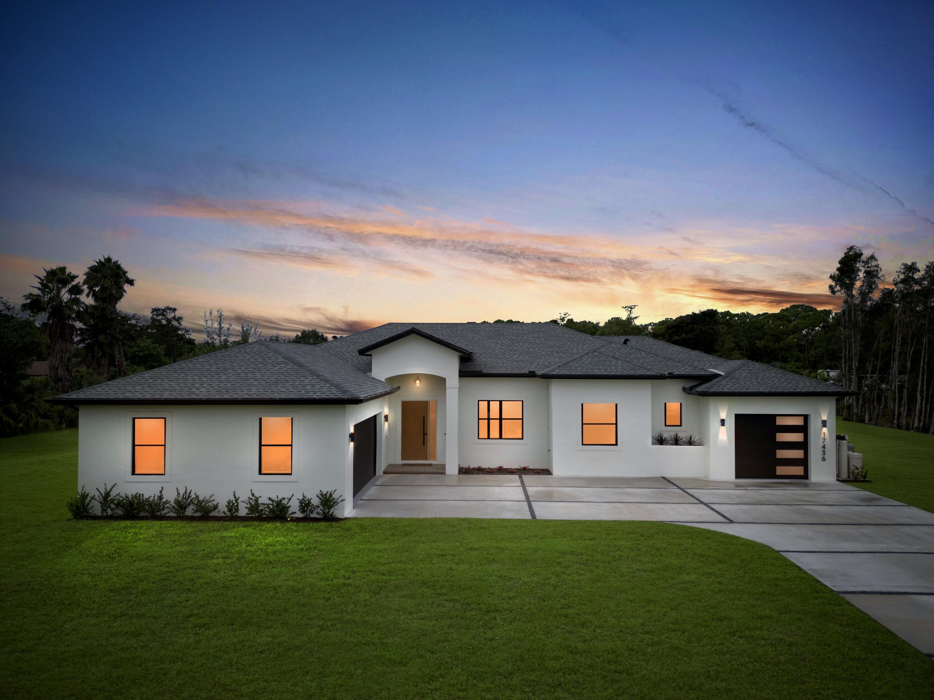 17436 71st Lane North Loxahatchee, FL 33470 - Photo 1 of 50 a front view of a house with a yard