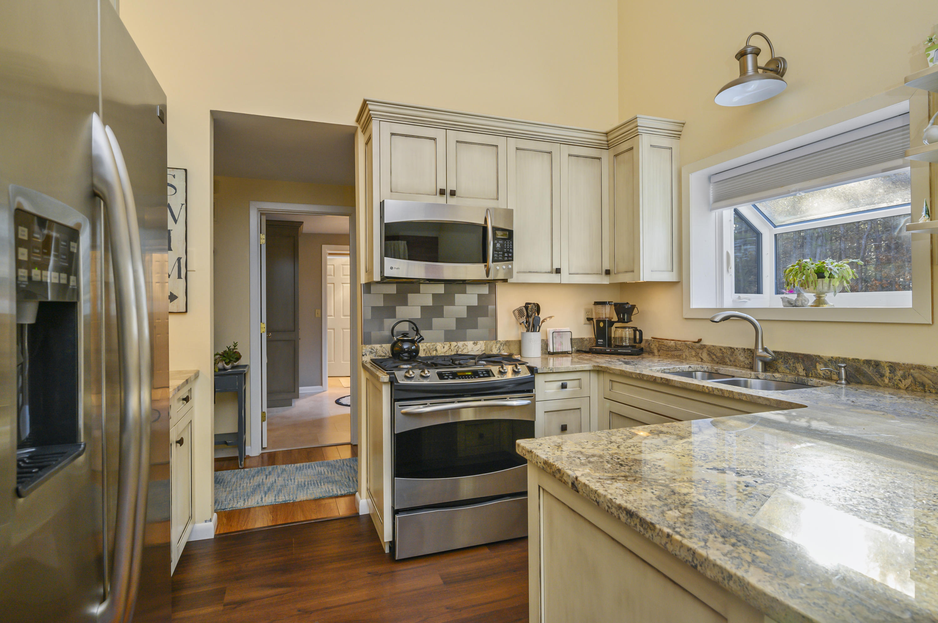 Undisclosed Address Mashpee, MA 02649 - Photo 11 of 21 a kitchen with granite countertop a refrigerator stove and sink