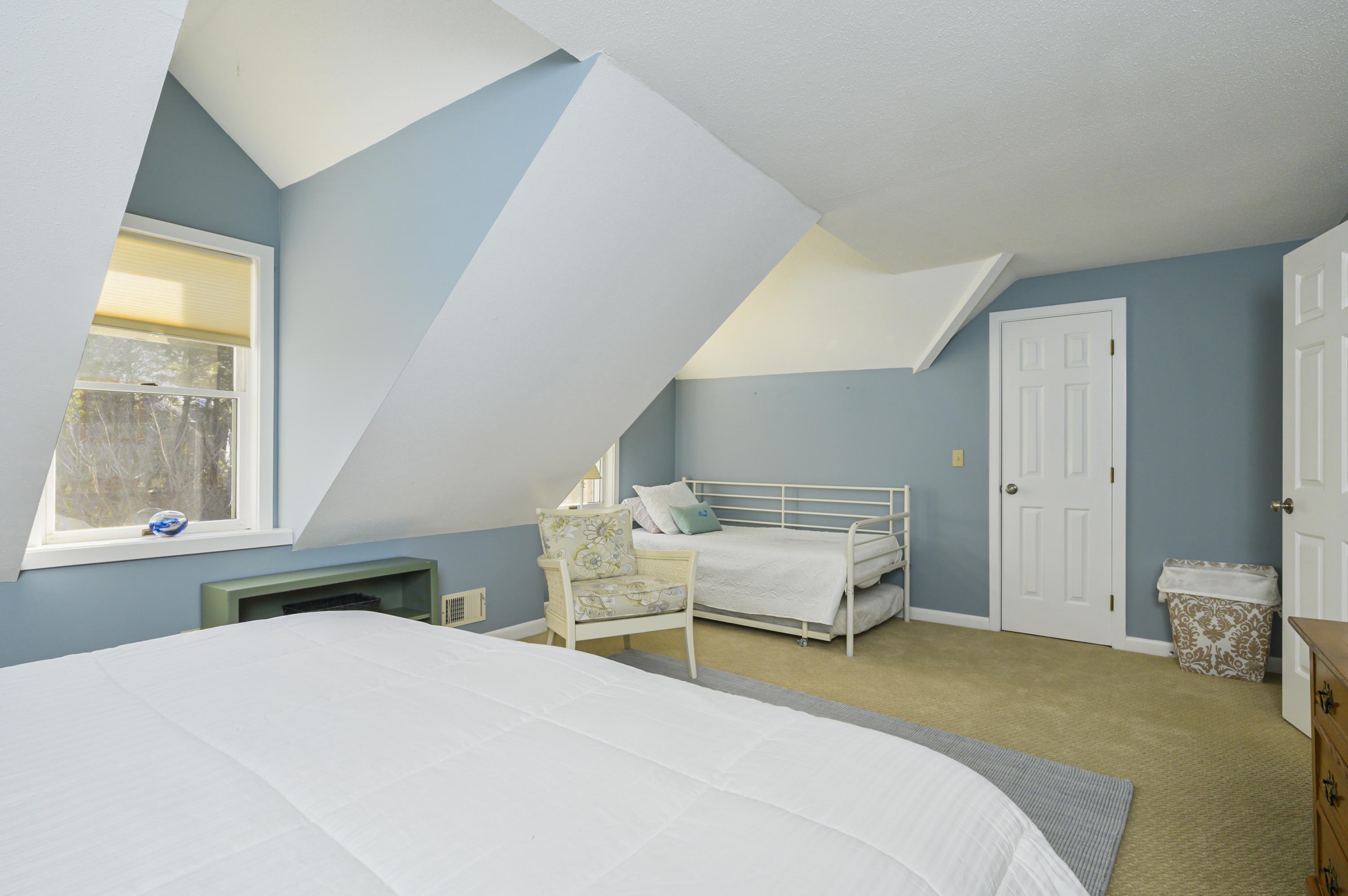 Undisclosed Address Mashpee, MA 02649 - Photo 16 of 21 a bedroom with a bed and window