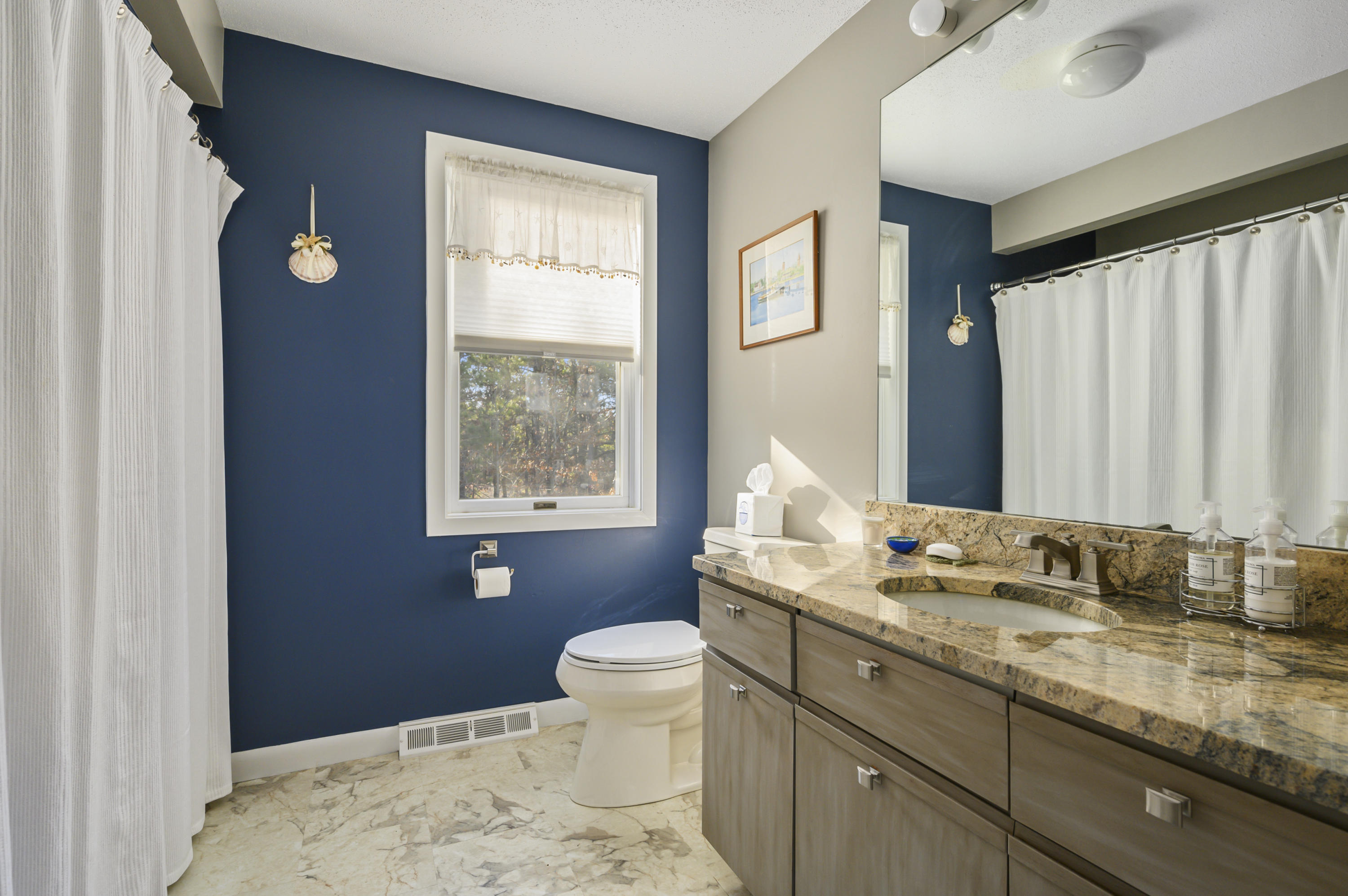 Undisclosed Address Mashpee, MA 02649 - Photo 18 of 21 a bathroom with a granite countertop sink toilet and large mirror