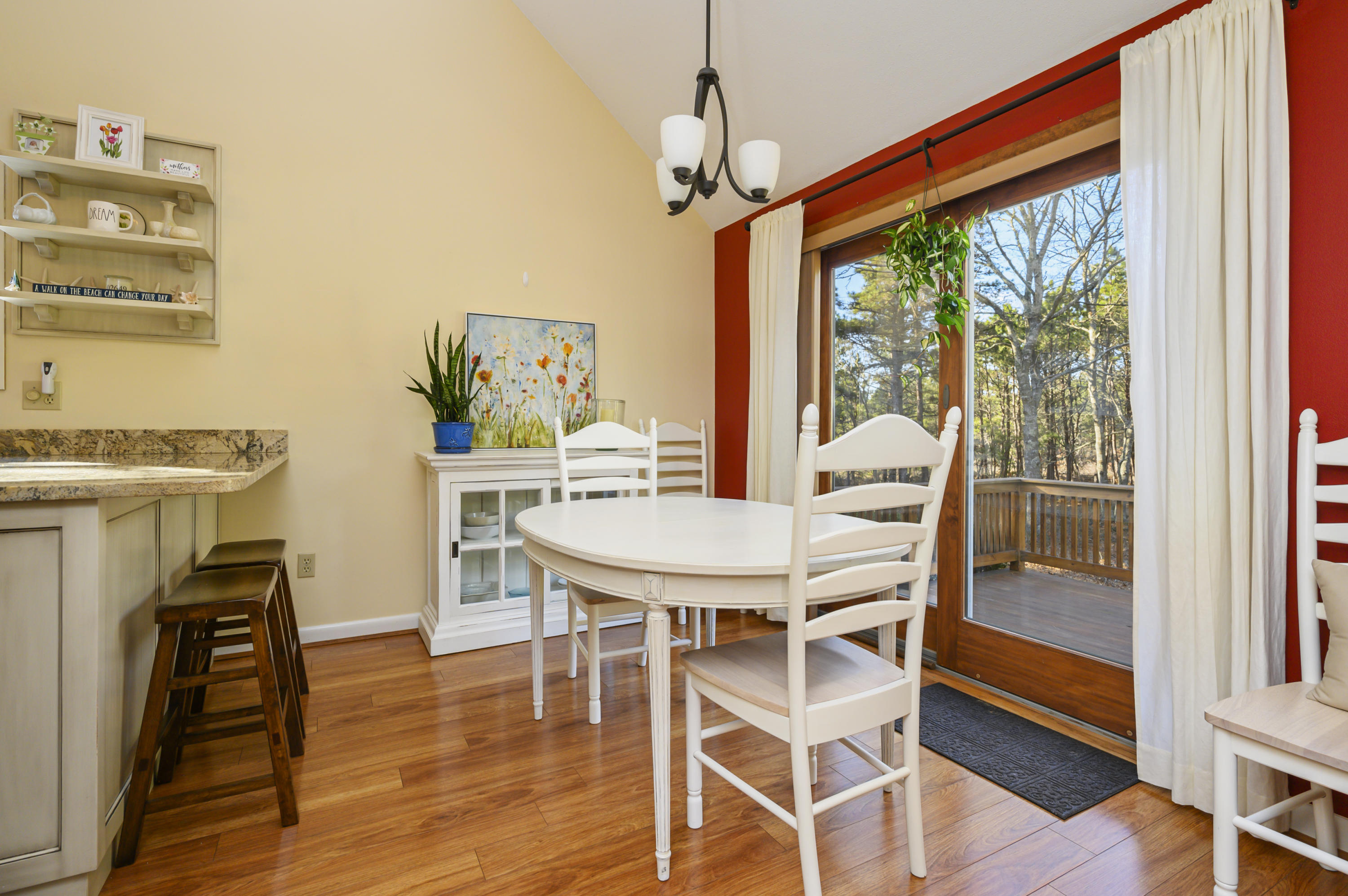 Undisclosed Address Mashpee, MA 02649 - Photo 10 of 21 a view of a dining room with furniture window and wooden floor