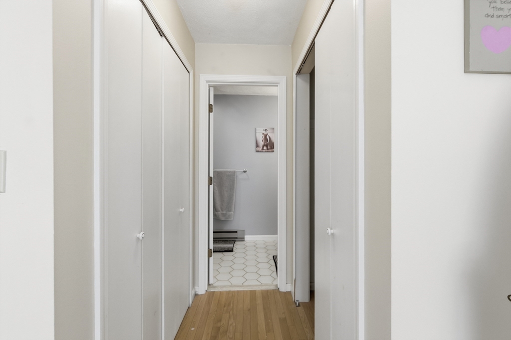 4 Erick Road, Unit 90 Mansfield, MA 02048 - Photo 13 of 30 a view of a bathroom from a hallway