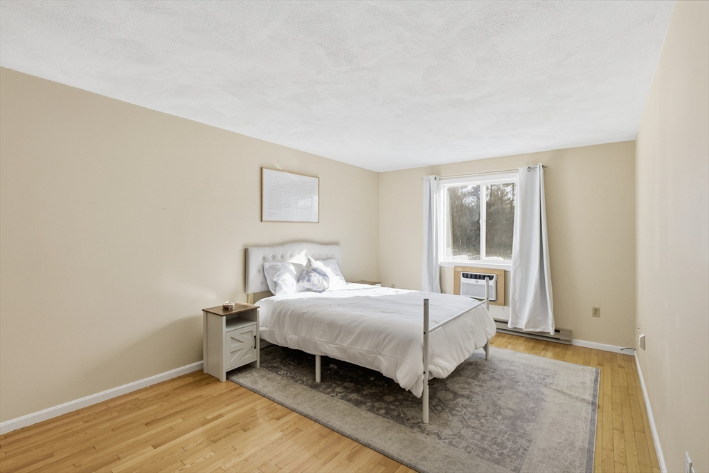 4 Erick Road, Unit 90 Mansfield, MA 02048 - Photo 14 of 30 a bedroom with a bed and a window