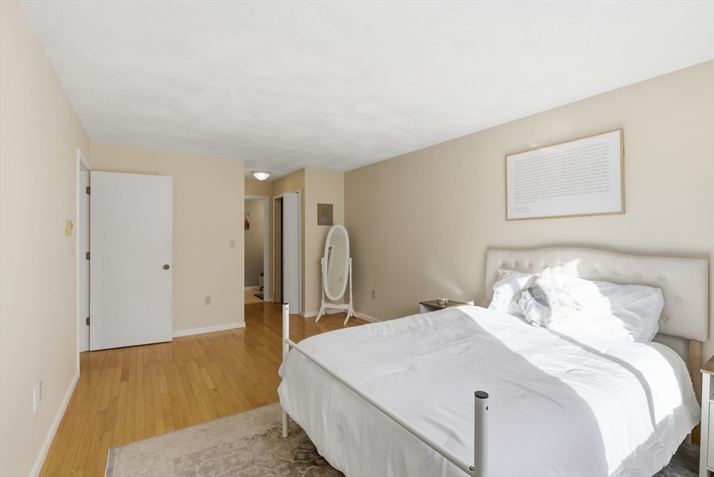 4 Erick Road, Unit 90 Mansfield, MA 02048 - Photo 15 of 30 a large white bed in a white room