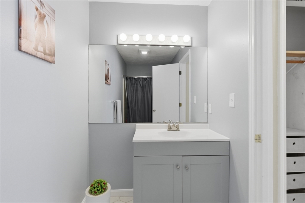 4 Erick Road, Unit 90 Mansfield, MA 02048 - Photo 17 of 30 a bathroom with a sink and a mirror