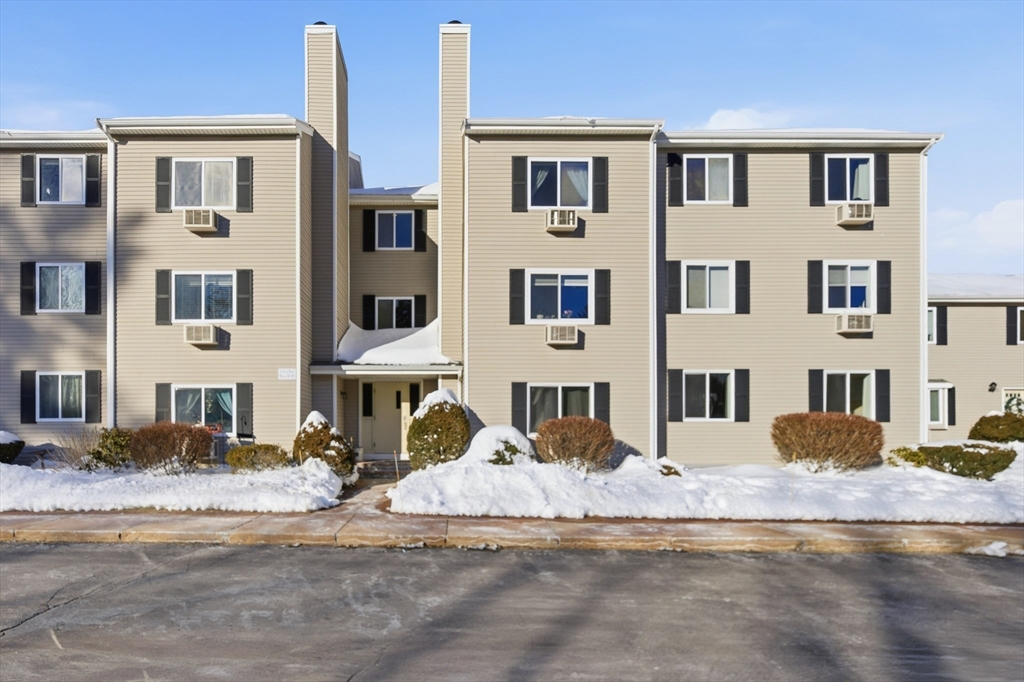 4 Erick Road, Unit 90 Mansfield, MA 02048 - Photo 24 of 30 a view of a white house with a yard
