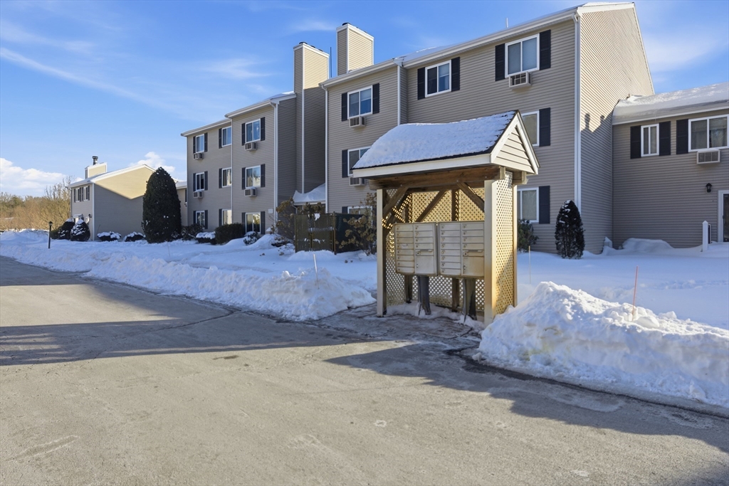 4 Erick Road, Unit 90 Mansfield, MA 02048 - Photo 26 of 30 a view of a brick house with many windows