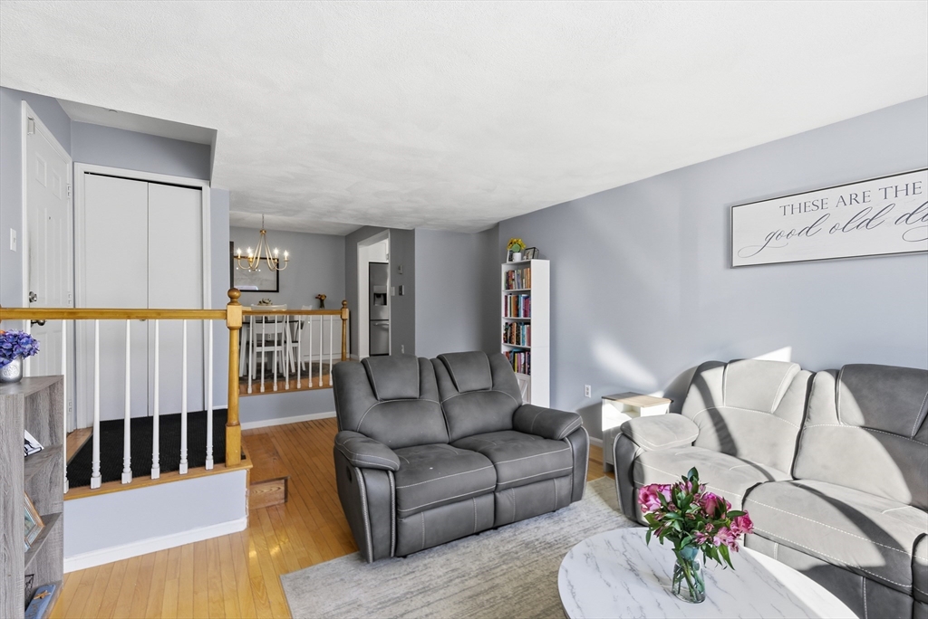 4 Erick Road, Unit 90 Mansfield, MA 02048 - Photo 3 of 30 a living room with furniture and wooden floor