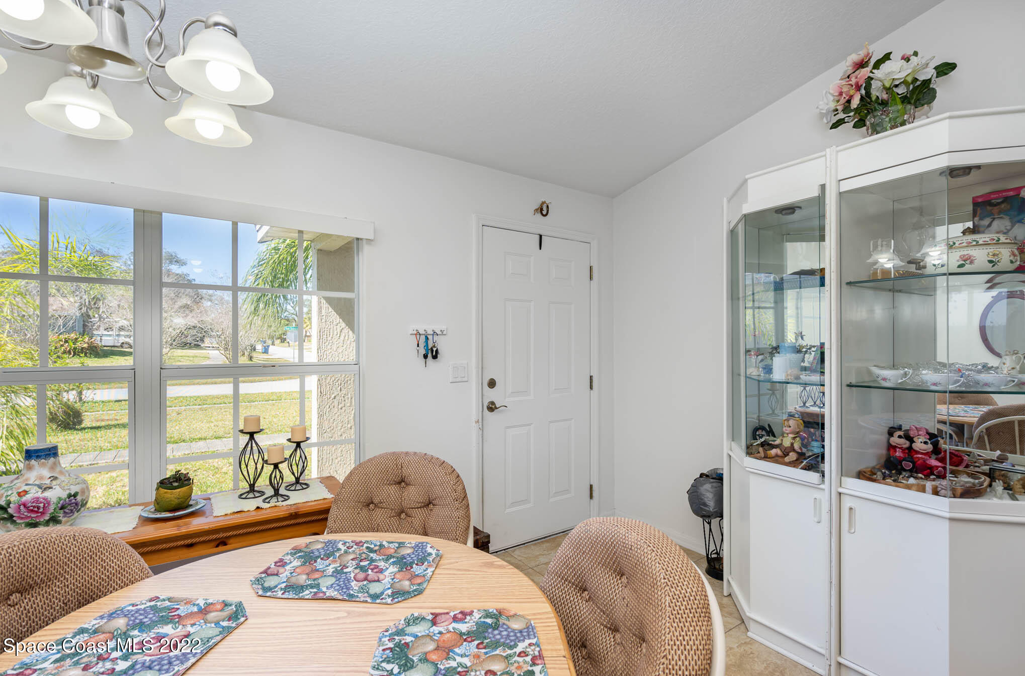 1247 Van Tassel Trail Palm Bay, FL 32905 - Photo 11 of 31 a bedroom with a bed dresser and window