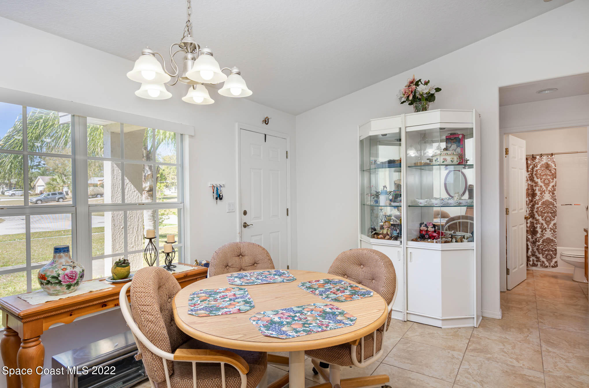 1247 Van Tassel Trail Palm Bay, FL 32905 - Photo 12 of 31 a dining room with furniture and window