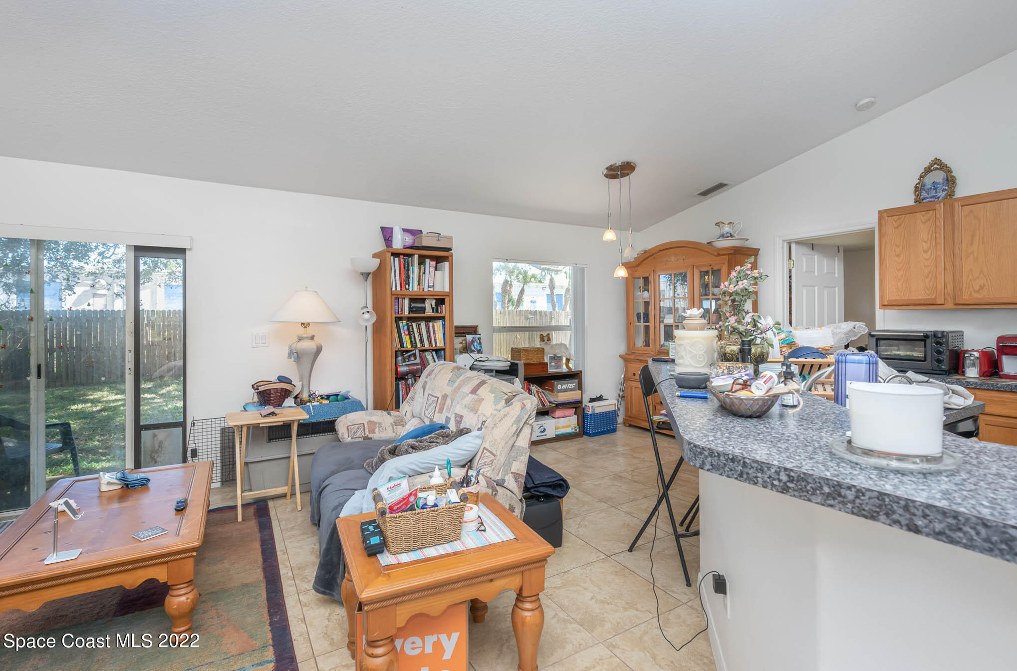 1247 Van Tassel Trail Palm Bay, FL 32905 - Photo 14 of 31 a view of a living room and dining room