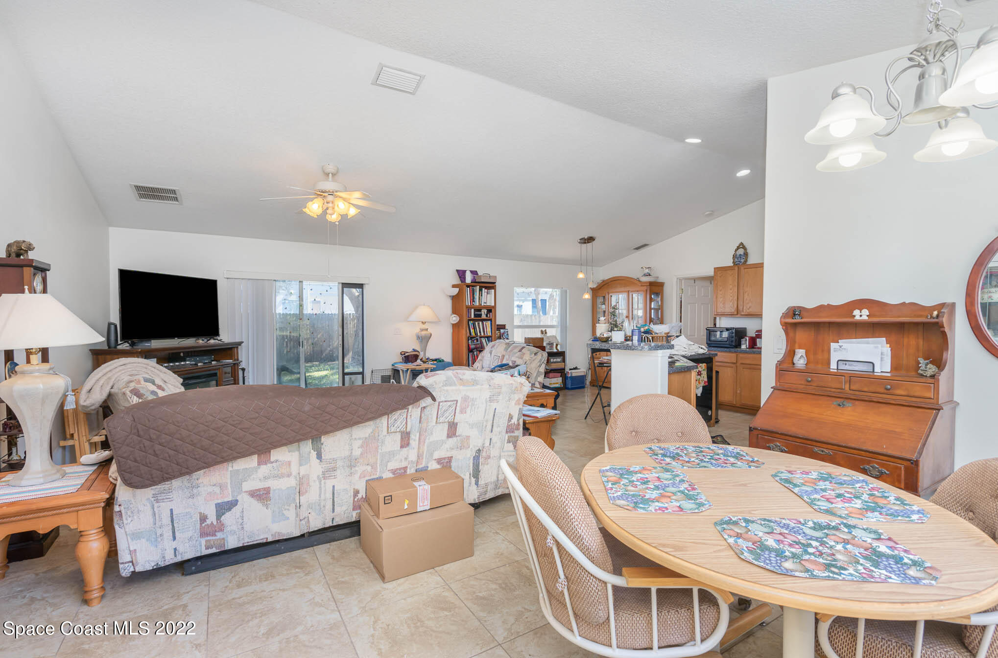 1247 Van Tassel Trail Palm Bay, FL 32905 - Photo 15 of 31 a living room with furniture and a flat screen tv