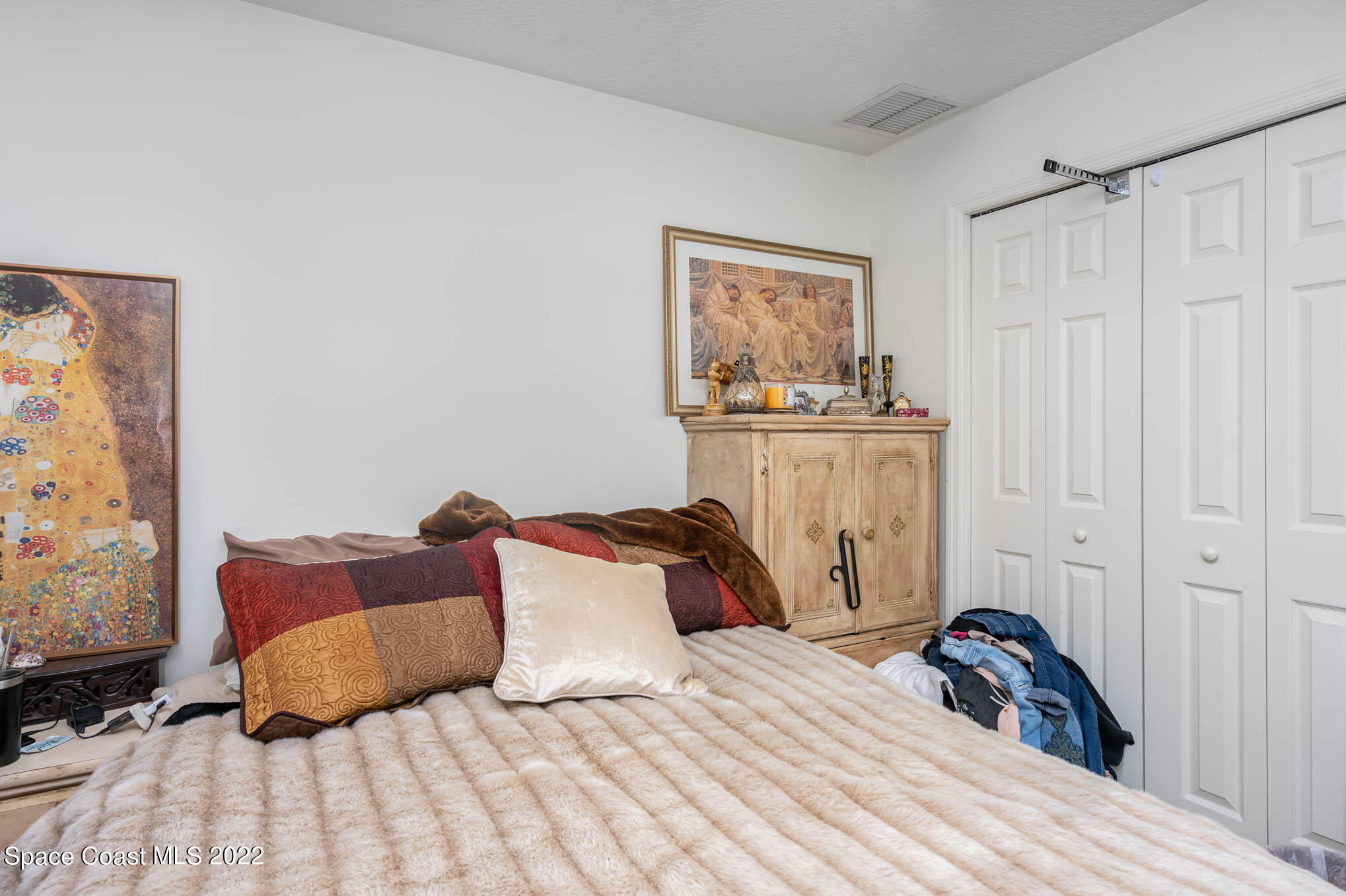 1247 Van Tassel Trail Palm Bay, FL 32905 - Photo 18 of 31 a bedroom with a bed and a window