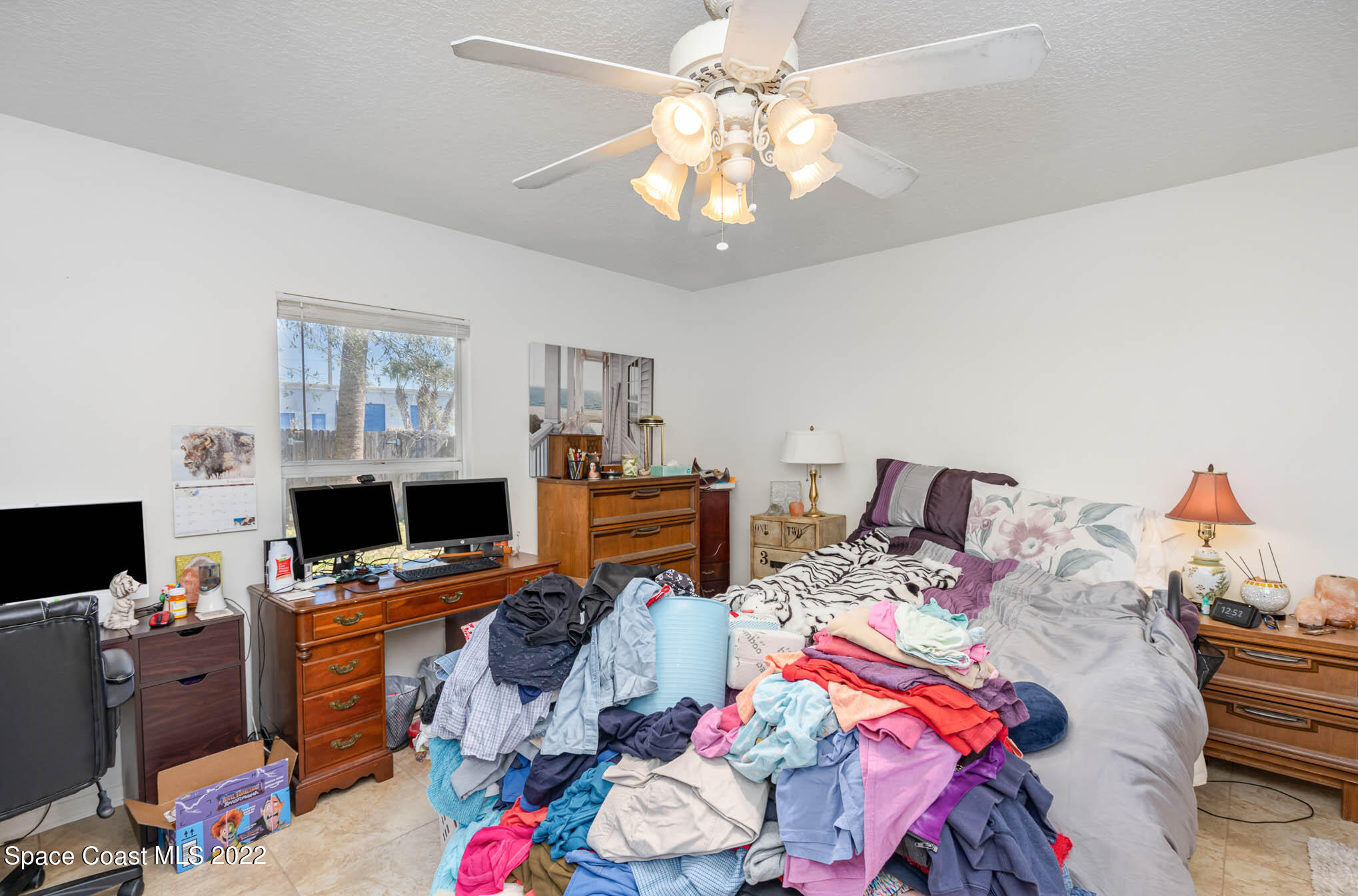 1247 Van Tassel Trail Palm Bay, FL 32905 - Photo 21 of 31 a view of a workspace with furniture and a bedroom