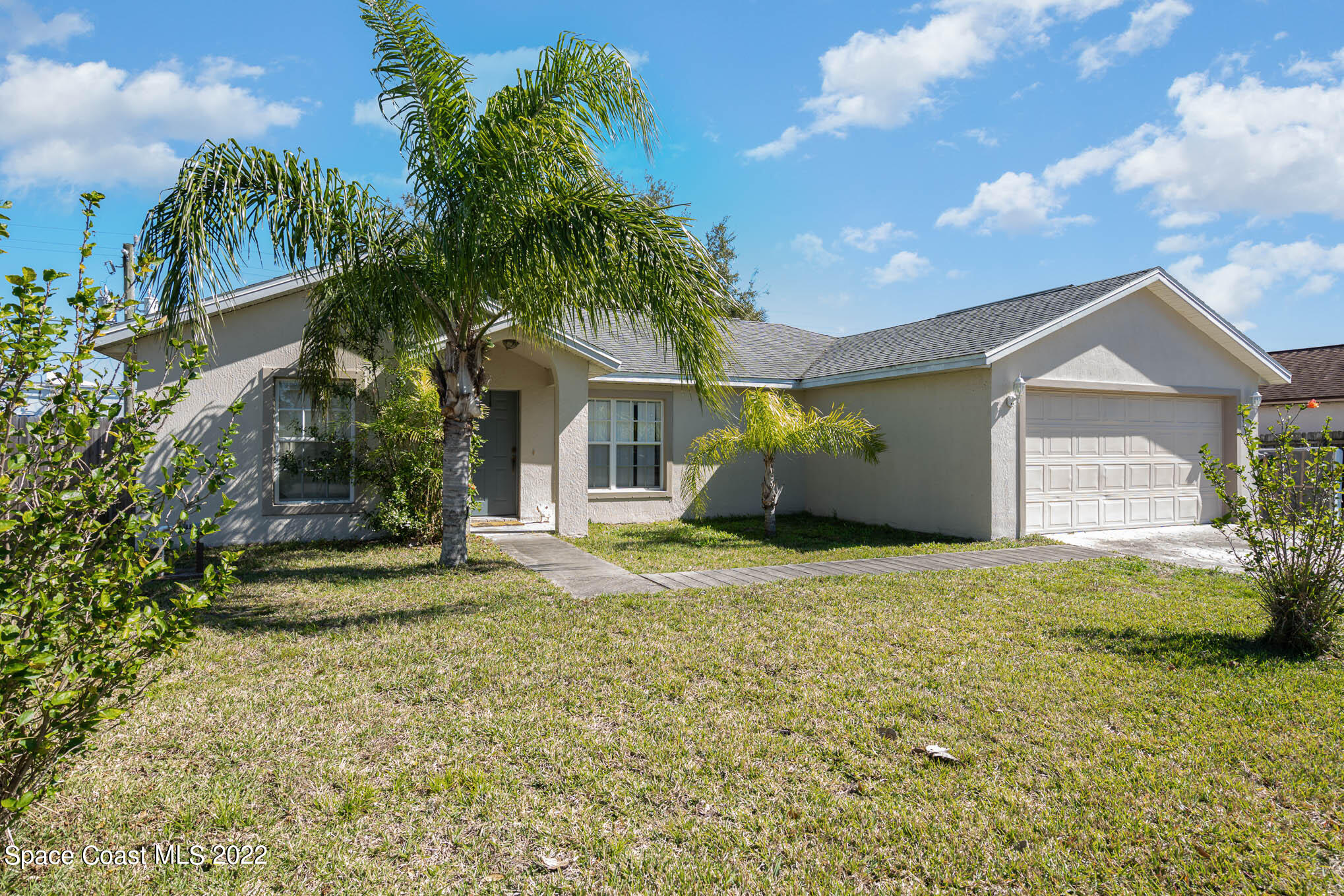 1247 Van Tassel Trail Palm Bay, FL 32905 - Photo 30 of 31 a bathroom with a sink and garden