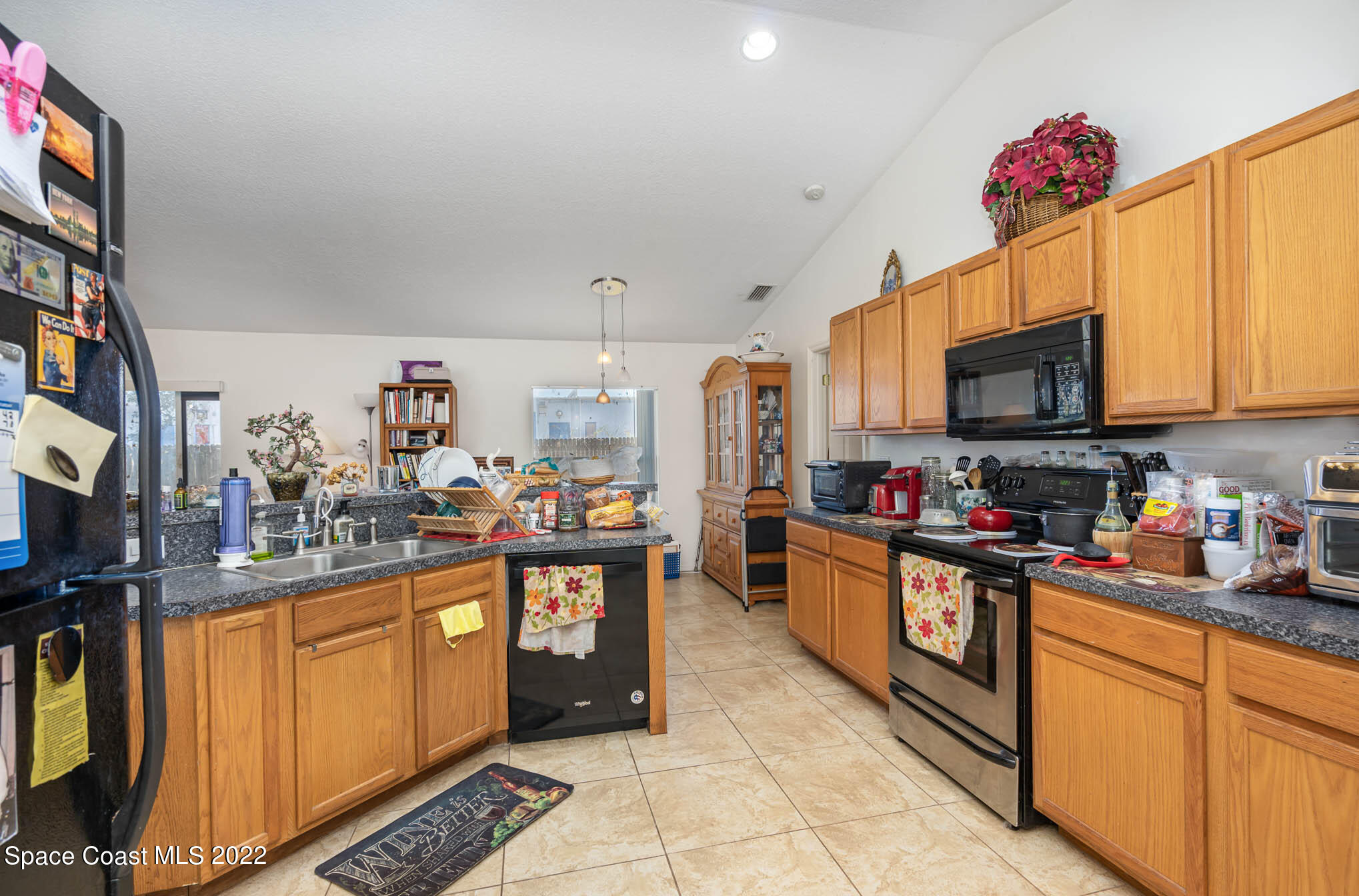 1247 Van Tassel Trail Palm Bay, FL 32905 - Photo 9 of 31 a kitchen with granite countertop lots of counter top space