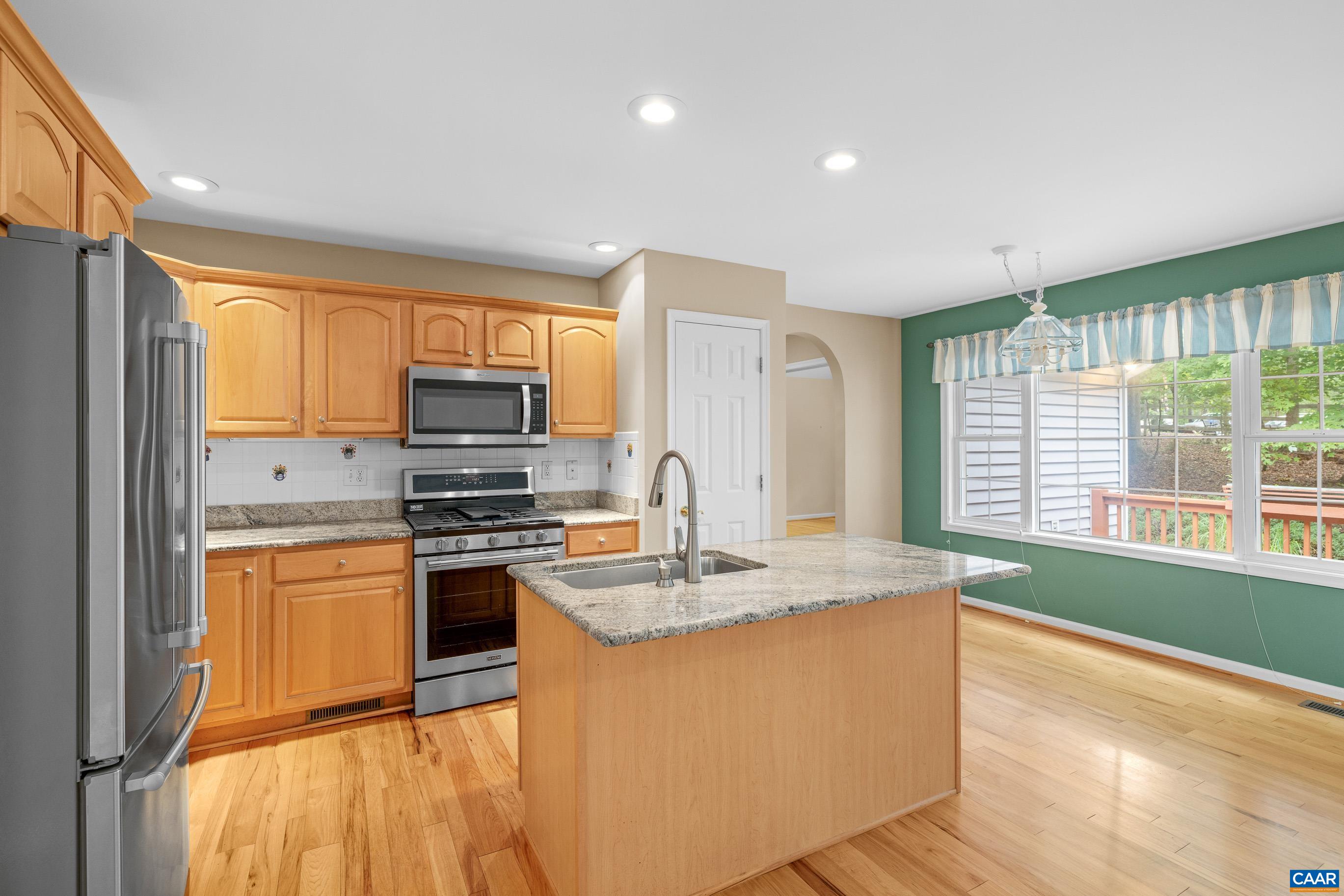 34 Zephyr Road Palmyra, VA 22963 - Photo 23 of 38 a kitchen with stainless steel appliances granite countertop a sink stove and refrigerator