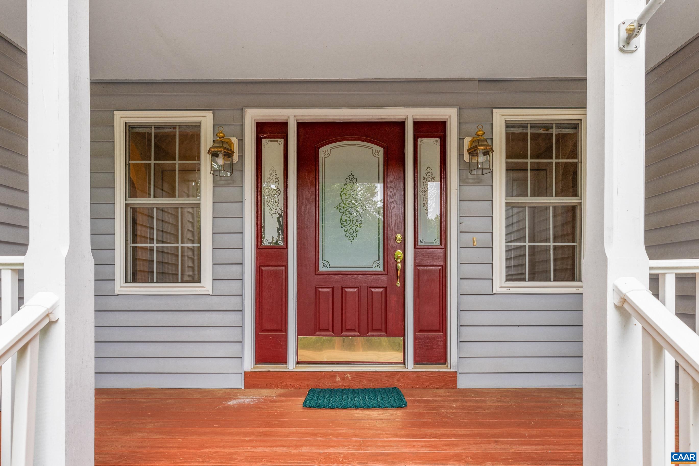 34 Zephyr Road Palmyra, VA 22963 - Photo 10 of 38 a view of a brick house with a door and a window