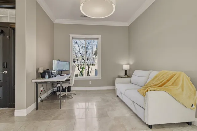 a living room with furniture and a window