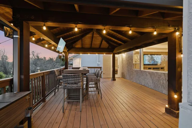 a view of a porch with wooden floor