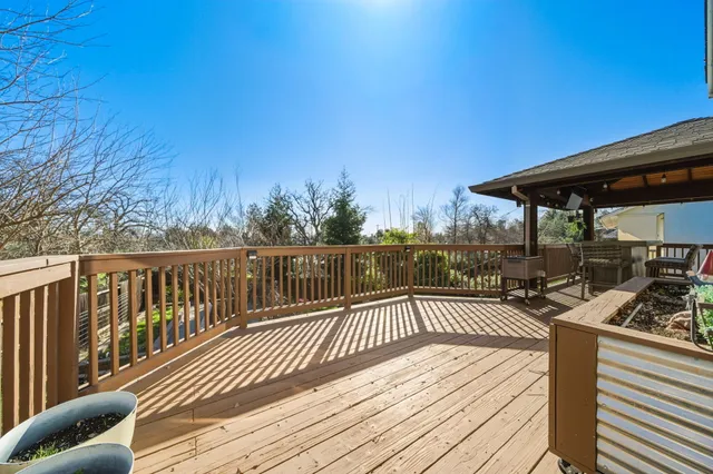 a view of a wooden deck with a patio