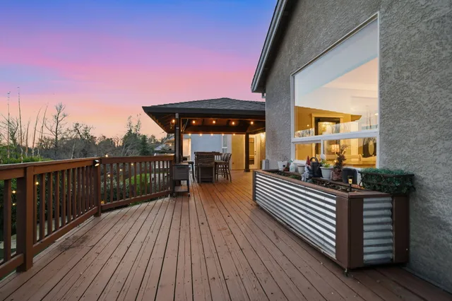a view of a balcony with wooden floor