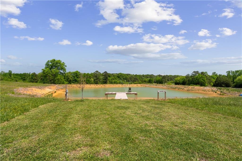 876 Cline Road Resaca, GA 30735 - Photo 39 of 57 a view of a lake with houses in the back